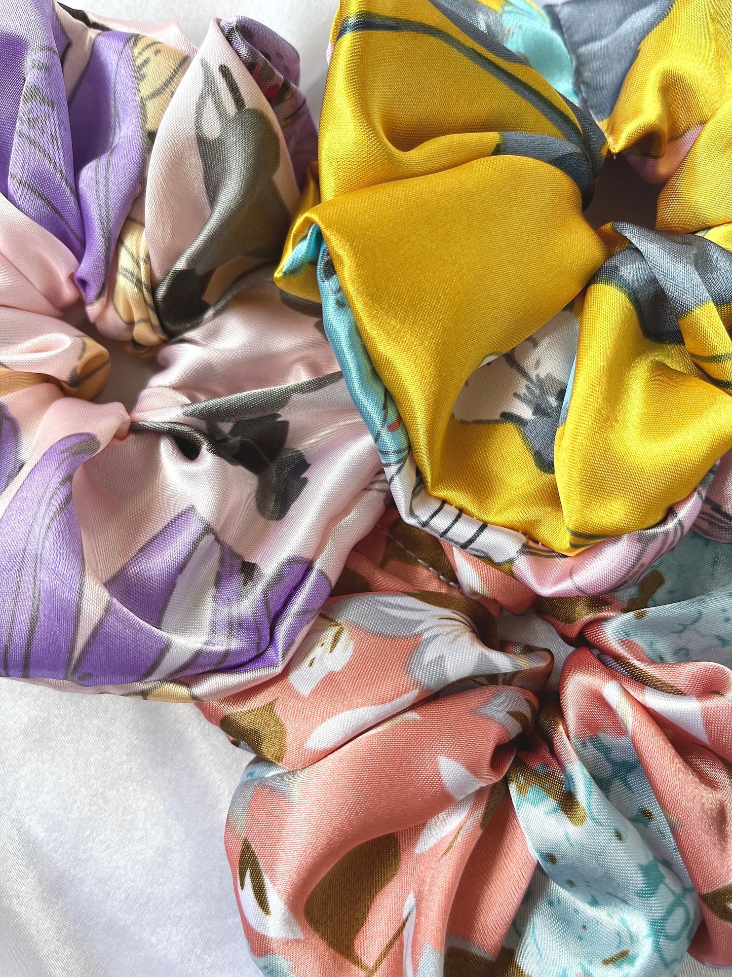 XL Scrunchies in delightful spring floral patterns satin fabrics. Silk scrunchies, giant scrunchies, oversized scrunchies, jumbo scrunchies.