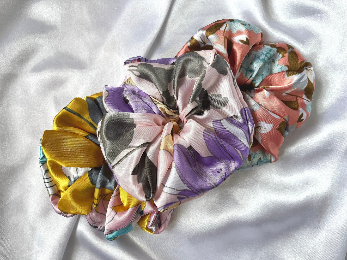 XL Scrunchies in delightful spring floral patterns satin fabrics. Silk scrunchies, giant scrunchies, oversized scrunchies, jumbo scrunchies.
